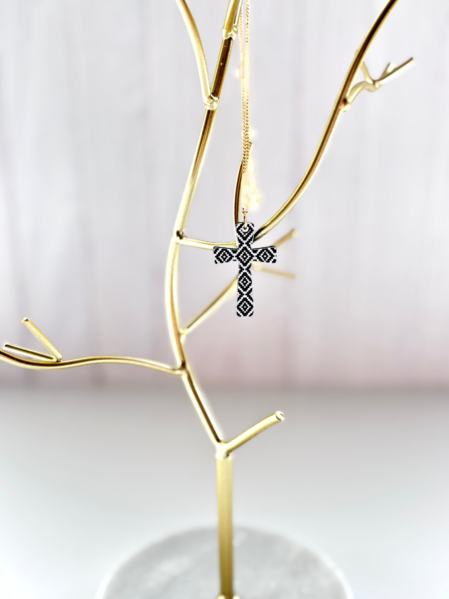 Gold Cross Necklace – Black & White Geometric Design